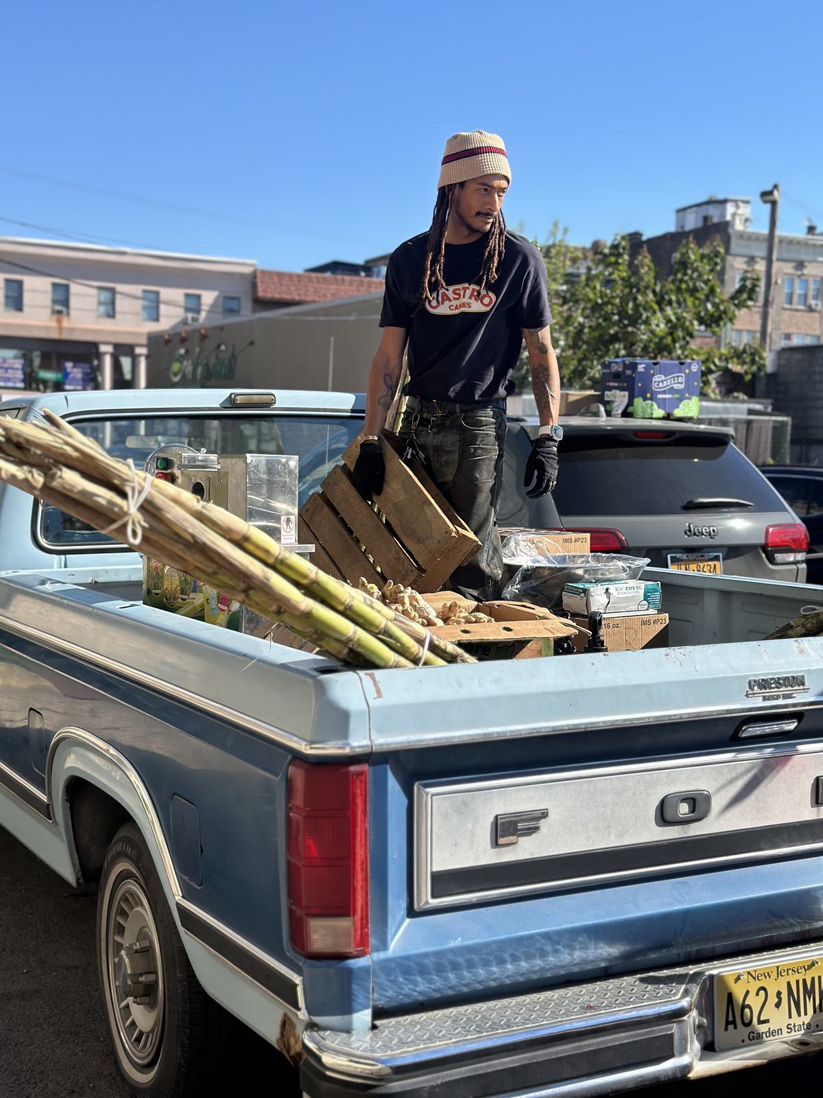 The vintage pickup with its bed full of sugarcane stalks