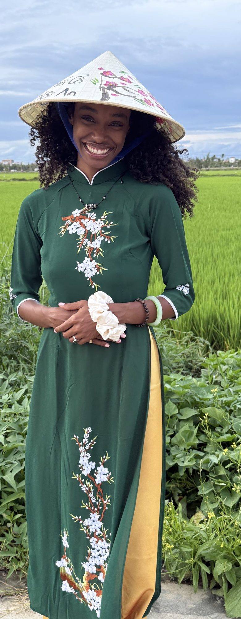 Kari standing at the edge of a rice field