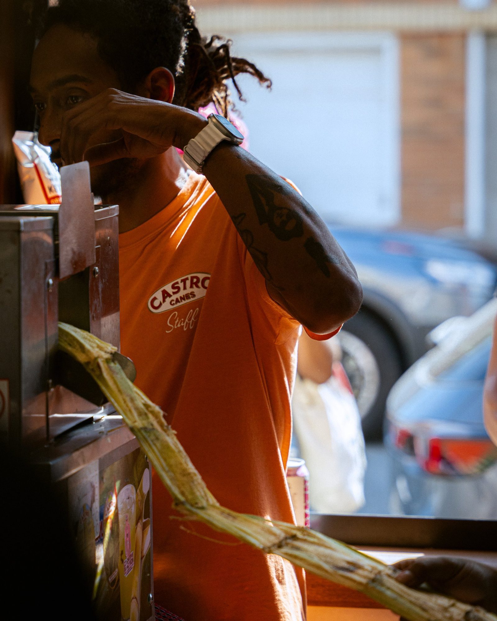 A cup of just-pressed sugarcane juice with lime and ginger