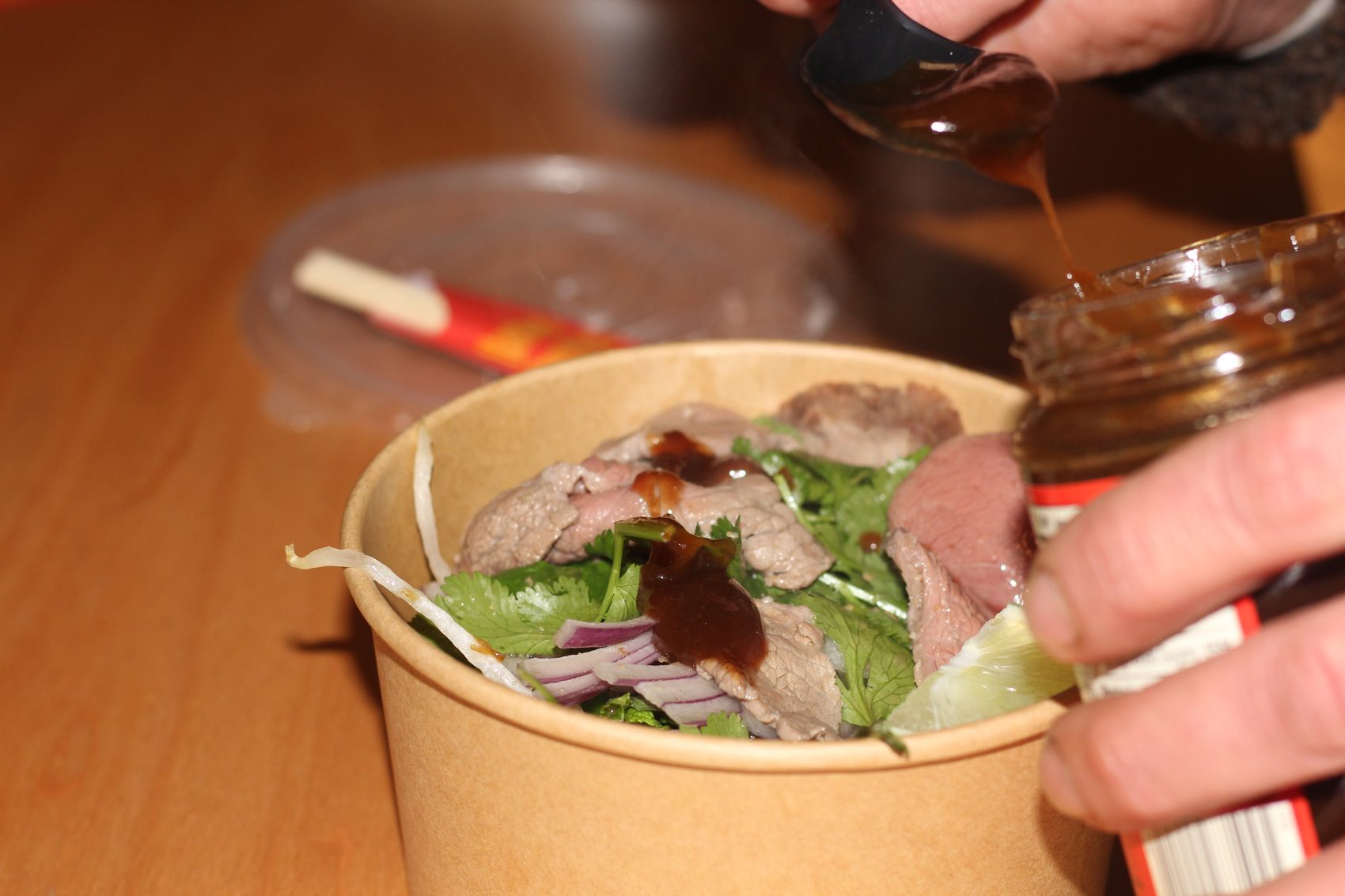 Hoisin poured over the finished bowl